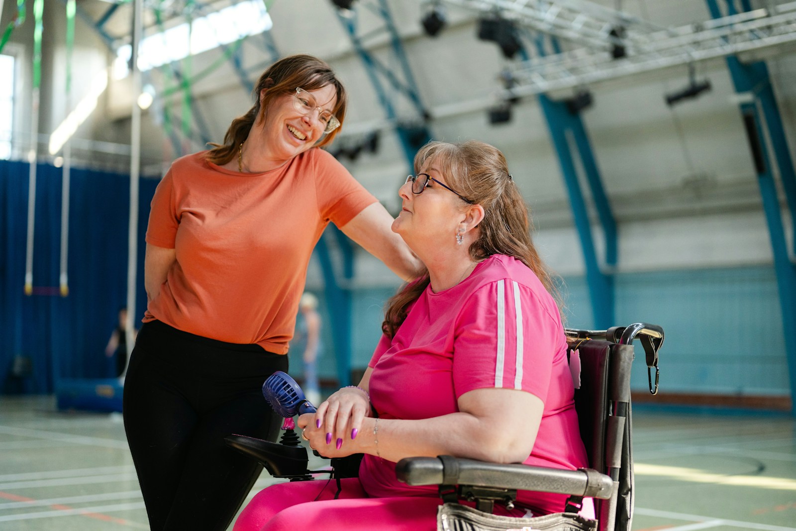 Photo by Centre for Ageing Better Two women talking in a gymnasium